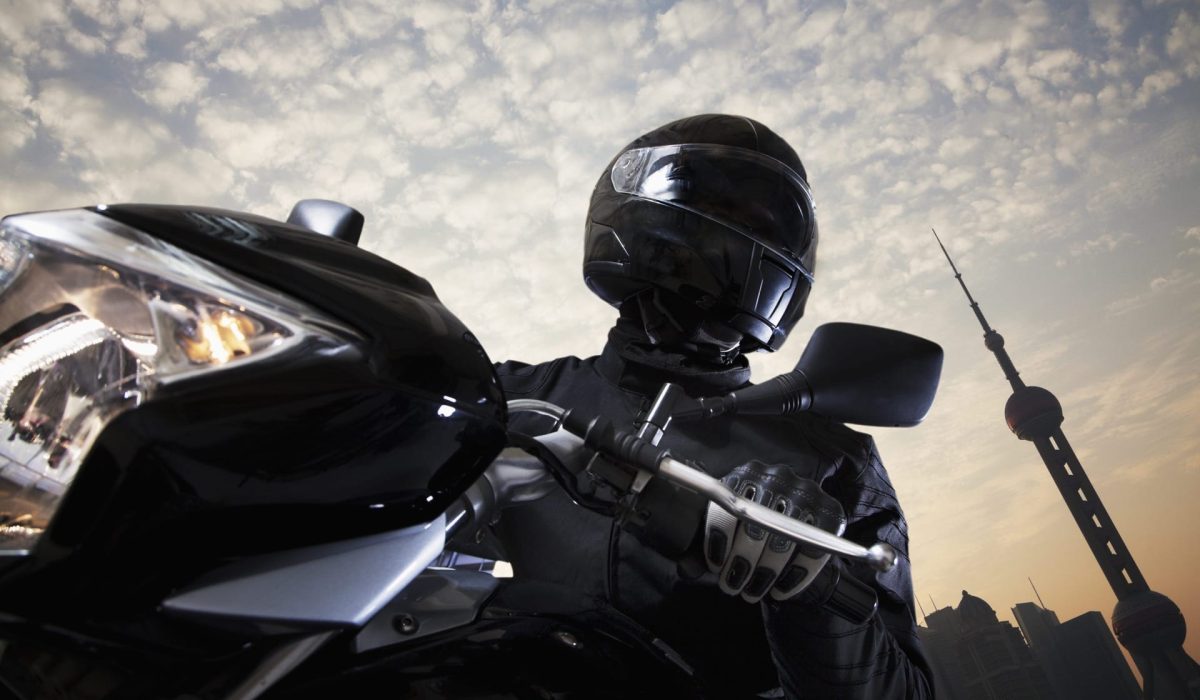 Person In A Black Helmet On A Black Motorcylce